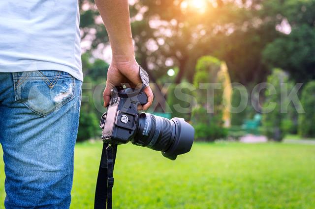 Photographer Holding Camera.