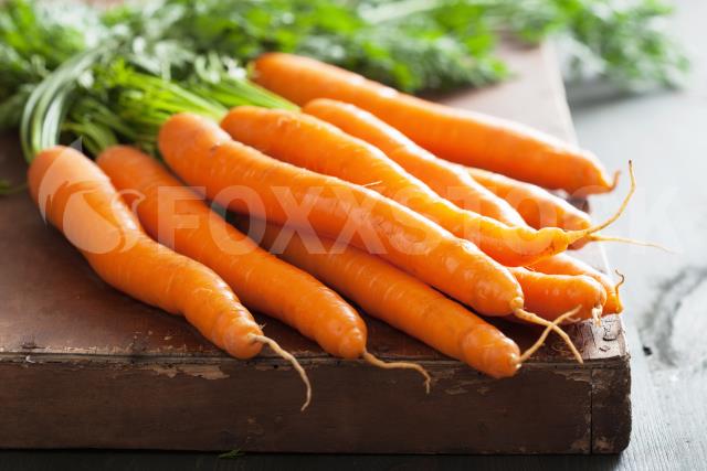 Fresh Carrot Over Wooden Background