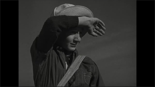 1940s: Long shot of farmhouse. Close up of boy, puts hand on forehead. Tracking shot of cotton field. 