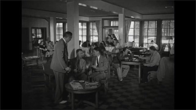 1940s: People seated around open room at different tables, talking, doing activities. Three men enter room, talking, drinking from glass bottles, sit at couch.