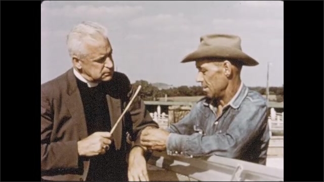 1950s: Clergyman leans on cattle rail, conferring with rancher about god and earth.