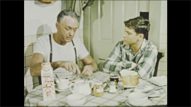 1950s: Boy struggles to express himself to mother at sink, father at table, to no avail.