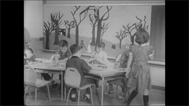 1950s: Children at their desks. Safety guide with sign. Girl walking with pencil.