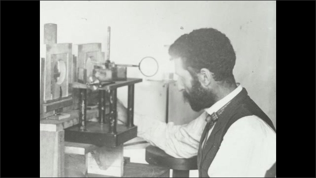 1900s: Photograph of Pierre Curie before scientific apparatus.