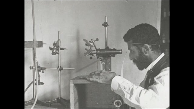 1900s: Photograph of Pierre Curie looking through an eyepiece