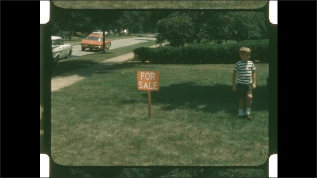 1960s: Shots of boy playing with ball in yard.