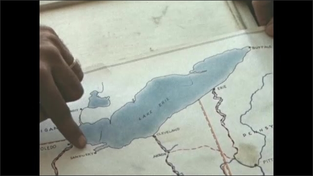 1840s: Lake Erie on map of Ohio, boy getting off dock onto boat