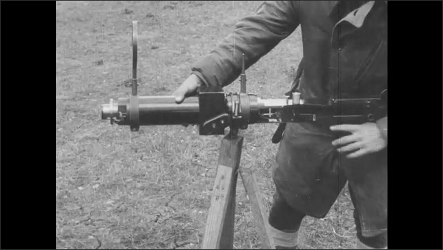 1910s France: Soldier prepares weapon to fire.
