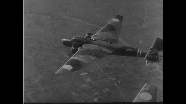 1940s China: Japanese fighter jets on mission. Jet drops bombs. People run through streets. Explosions. Fire and smoke.