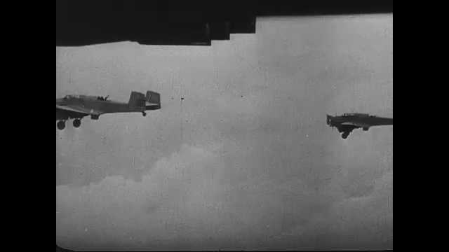 1940s China: Fighter jets drop bombs. People run through streets. Explosions. Fire and smoke.