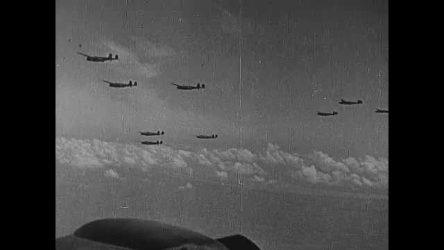 1940s China: Fighter jets fly in formation. Pilots in cockpit. Planes drop missiles. Explosions in water and on land.