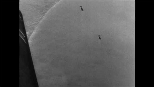 1940s ENGLAND: Planes fly through sky. Pilot talks. Planes dive. Ships in water. Planes drop bombs. Bombs explode in water.