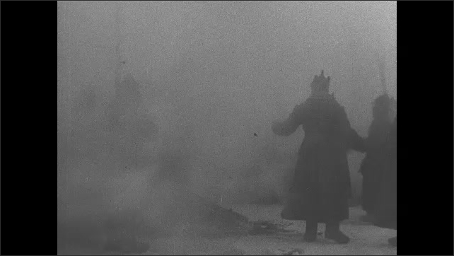 1910s USSR: Mourners remove their caps. Cannons shoot in tribute off boats. 
