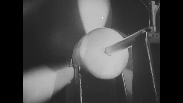 1930s: Intertitle. Fan in wind tunnel spins.