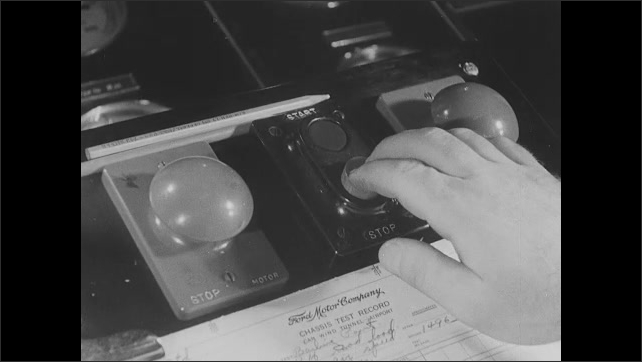 1930s: Panels in wind tunnel. Fan in tunnel. Temperature elements in tunnel. Wind blasts over car in test. Person controls knobs and gauges for wind tunnel experiment.