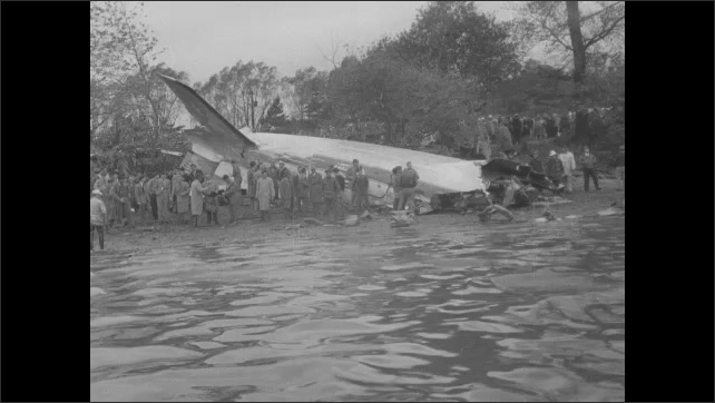 1940s: People load bales of hay onto plane. Bales of hay dropped from ...