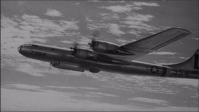 1940s Bikini Atoll: Plane flies through the sky.