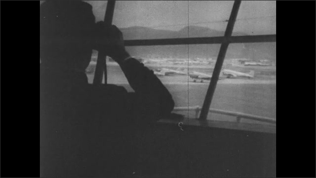 1950s Greece: Plane reads "CYPRUS."  Passengers get off plane.  Man in air traffic control tower.  Airplane takes off.  Sky.