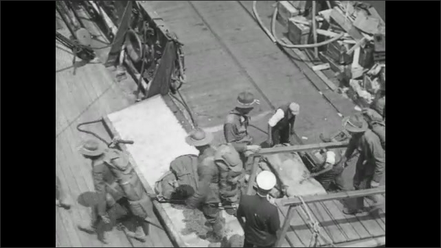 1910s Virginia: Intertitle card. Soldiers walk down dock, board ship. Soldiers aboard ship. Soldiers pose on ship rigging. Intertitle card. 