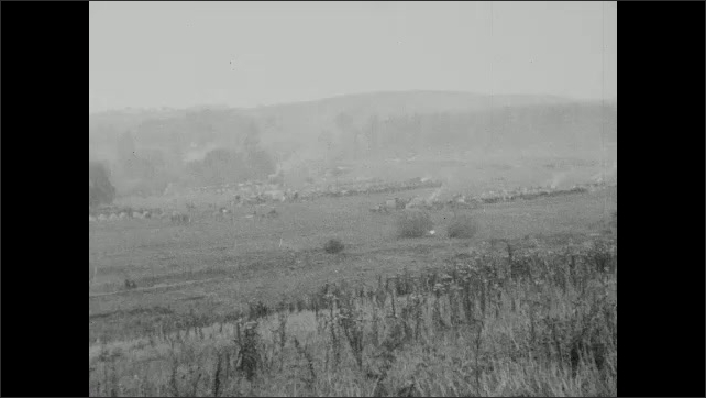 1910s: Field, rolling hills, trees. 