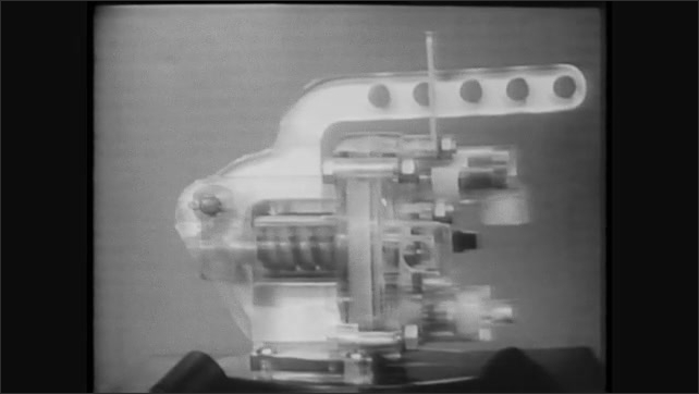 1960s: See through model of air brake valve. Man takes apart valve ...