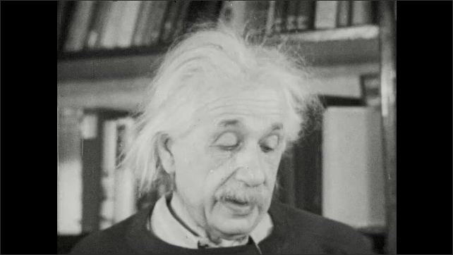 1940s: Albert Einstein stands near bookshelf and speaks. 