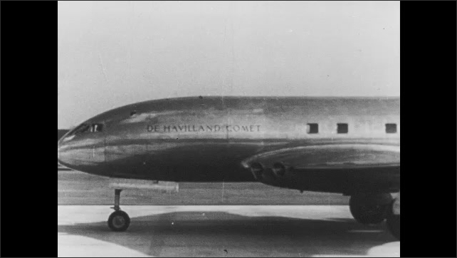 1940s Britain: Airplanes parked on tarmac. Airplane taxis on runway. Credits: The End. Crown Film Unit.