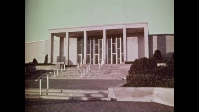 1940s: Car drives past the exterior of the Harry Truman Presidential Library.