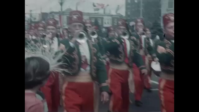 1950s: Shriners members in costume march in parade. Shriner drives mini ...