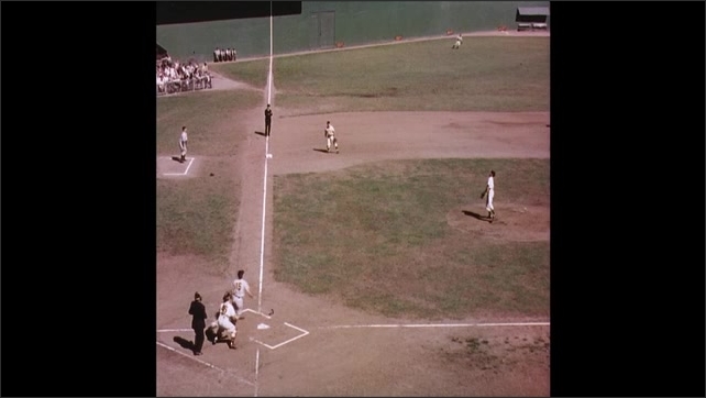 1940s: Woman rubbing man's back. Crowd at baseball stadium. Pitcher throwing baseball. Batter hitting baseball, running. Umpire calling runner safe at first base. People sailing in small boat.