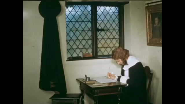 1600s: puritan man writing at desk then reading what he's written