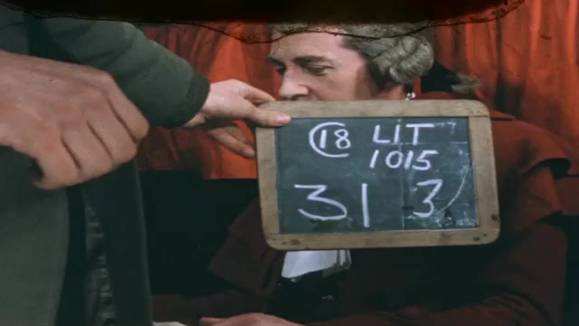 1730s: Hand holds chalkboard shooting slate.  Restaurant.  Men look at book and talk.  Man gestures.  Men drink tea.
