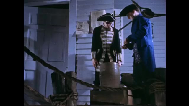1700s: Man attempts to purchase barrel from merchant on dock. Man picks up barrel and laughs.