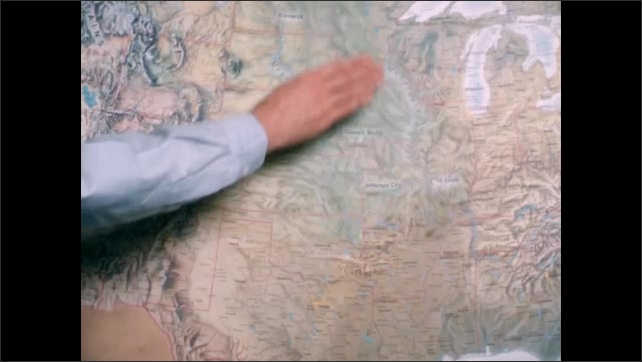 1800s: Film slate. Map of United States. Person points to Midwest area.