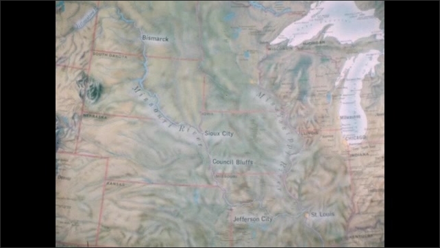1800s: Person holds film slate. Person points to Bismarck on map. Person points to Yellowstone River on map.