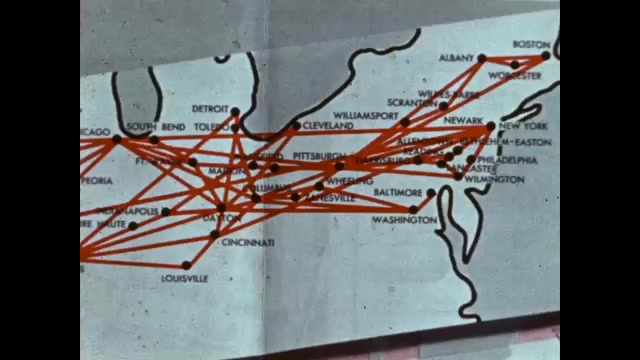 1950s: Map of airplane routes, finger traces across. Seat belt sign on ...