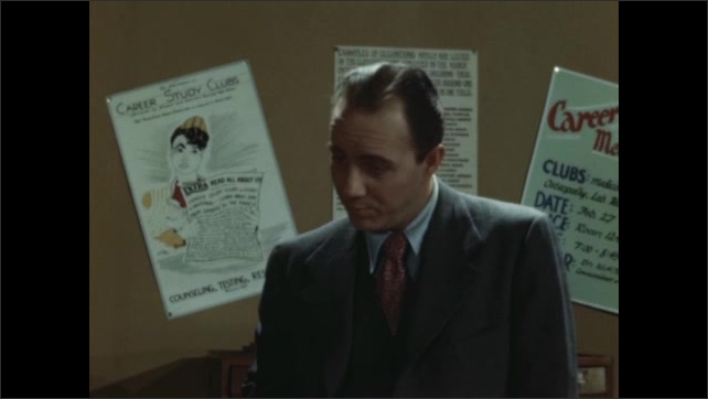 1940s: student talks with career’s advisor. Career posters on office wall. Career’s advisor talks with young an at desk. Lady snaps clapper board in front of actor’s face. Man in suit and tie. 