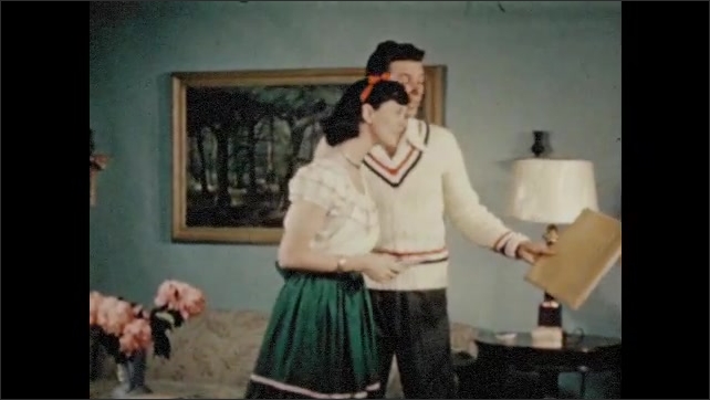 1940s: Teenage boy and girl talking in living room, girl exits. Girl walking on sidewalk. Close up, girl in window. 
