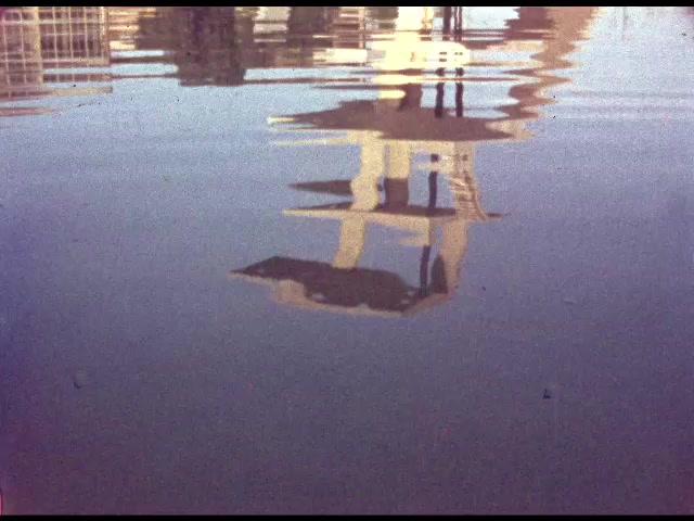 1960s: MEXICO: building reflected in water. Diving steps by water. Concrete platforms