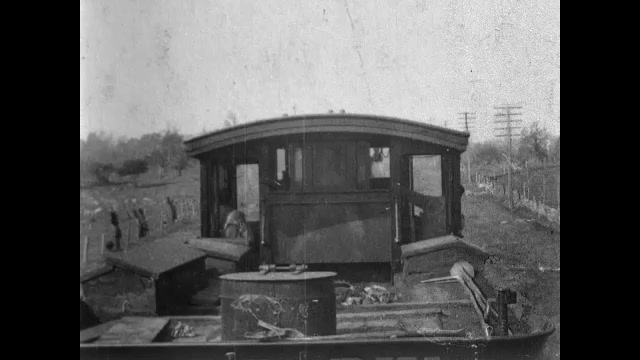 1900s: Train.  Robber attacks engineer.  Robber beats man and throws him off train.  Robbers stand near driver.
