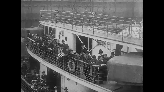1910s: People and vehicles on city street. People on the deck of the Lusitania.