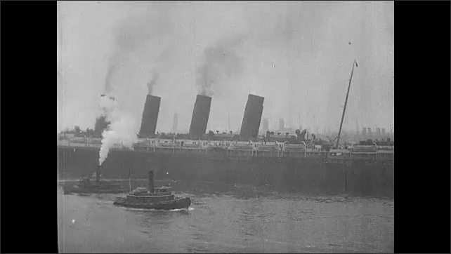 1910s: Lusitania in the water with boats around it.