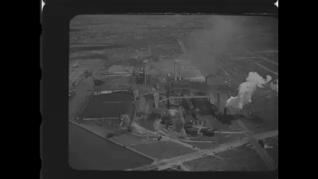 1920s: Looking down on factory from sky. Looking down on large factory complex.