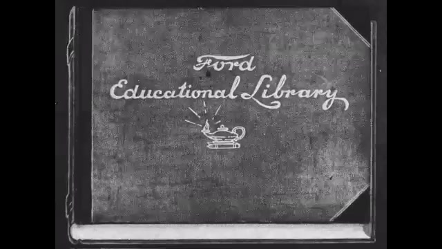 1910s: Title cards. Intertitle. People working outside at factory.