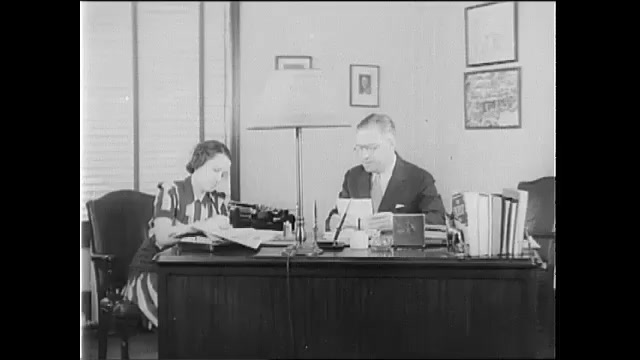 1940s: Man at desk, woman taking notes, woman exits, man enters, man takes paper and leaves. Woman with man at desk, woman exits. 