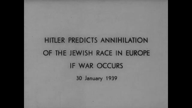 1930s Germany: Title card. Meeting of Nazi leaders. Hitler speaks.