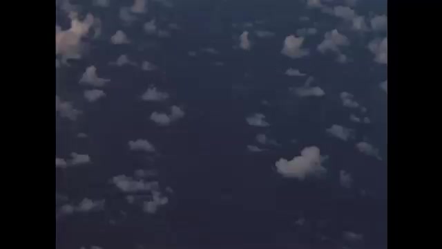 1940s Bikini Atoll: bomb denoting in ocean and forming mushroom cloud