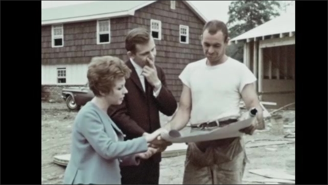 1960s: Man and woman approach construction worker. Men shake hands. Men and woman talk. Man shows plans to couple.