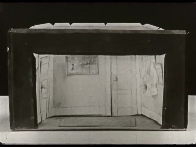 1940s: Different models of rooms in houses. Several students work nailing down paper to canvas. Students make frame for canvas.