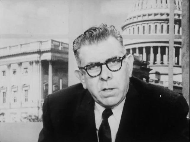 1960s: Congressman Willis speaking at a large desk.